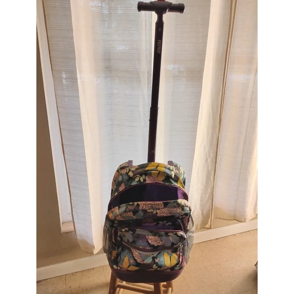 J World New York Rolling Backpack Retractable Handle Mesh Pockets Secret Garden